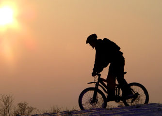 Mountain biker with helmet to protect head